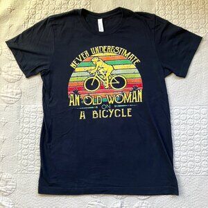 Women's Sz. Med Black Tee "Never Underestimate an Old Woman on a Bicycle"
